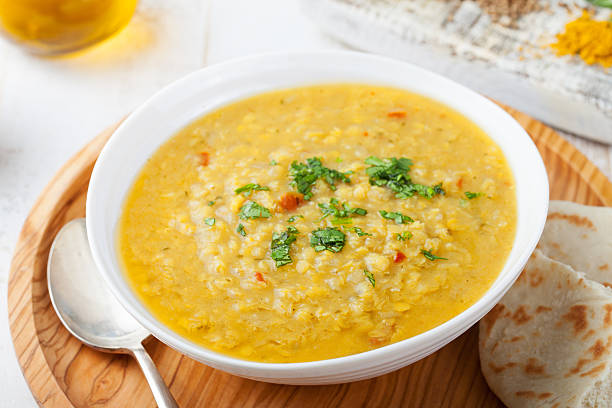 istock Lentil soup with pita bread in a ceramic white bowl 541300946