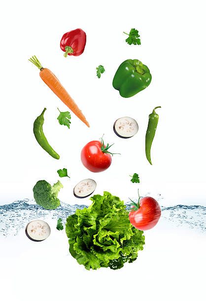 istock The vegetables are thrown into the water 541304156