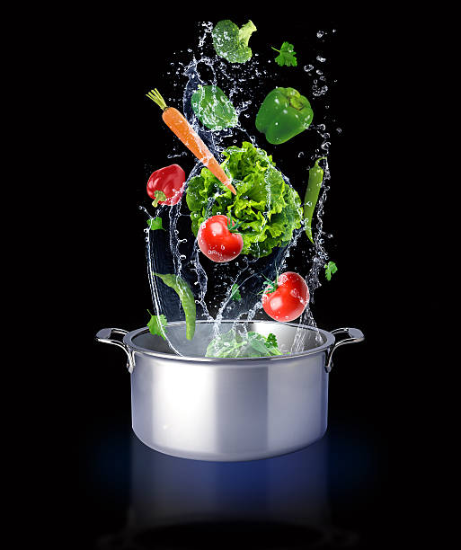 istock The vegetables are thrown into the water and pot 541304174