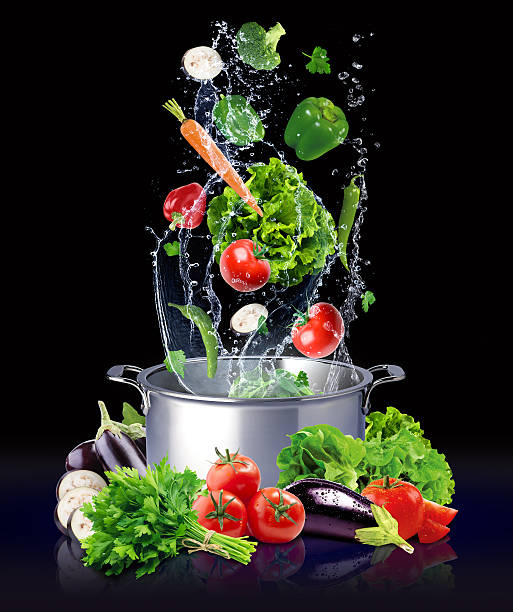 istock The vegetables are thrown into the water and pot 541304224