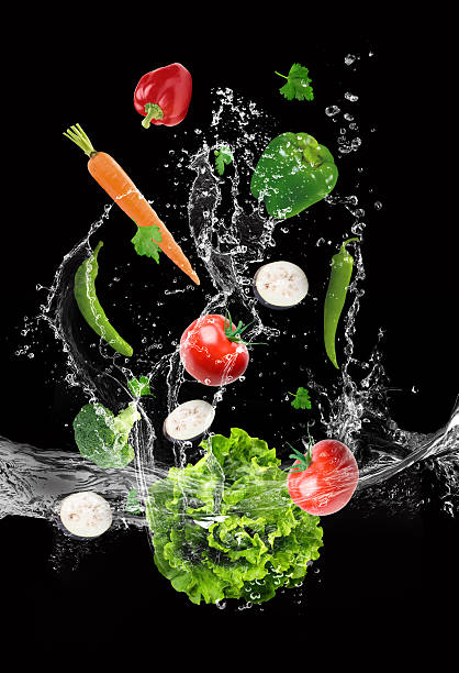 istock The vegetables are thrown into the water 541304280