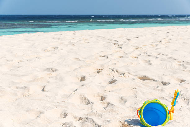 istock Children's beach toys on tropical beach 541307644