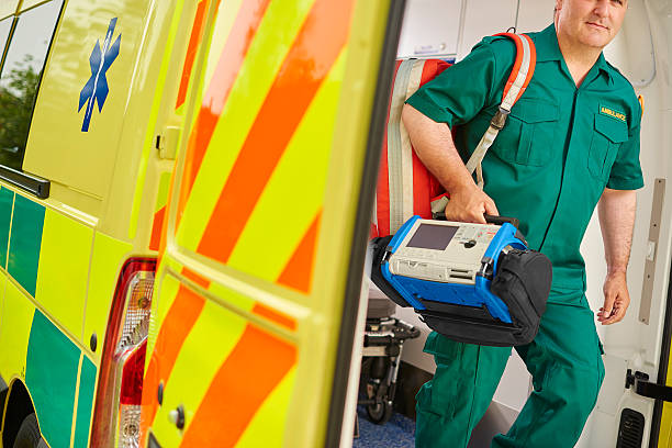 istock paramedic leaving the ambulance at scene 541312326
