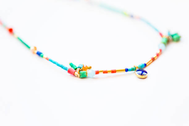 istock Necklace beads of different colors on white 541312952