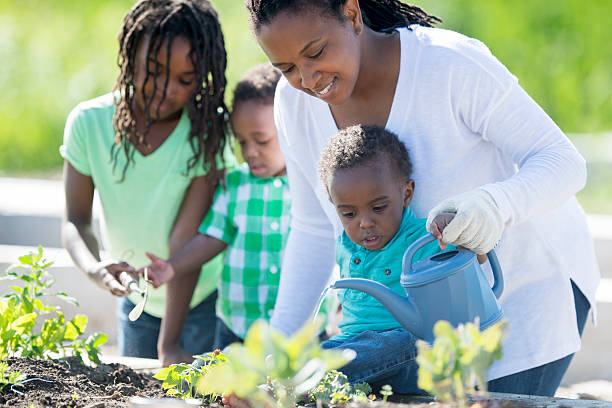 istock Single Mother Gardening with Her Children 541313248