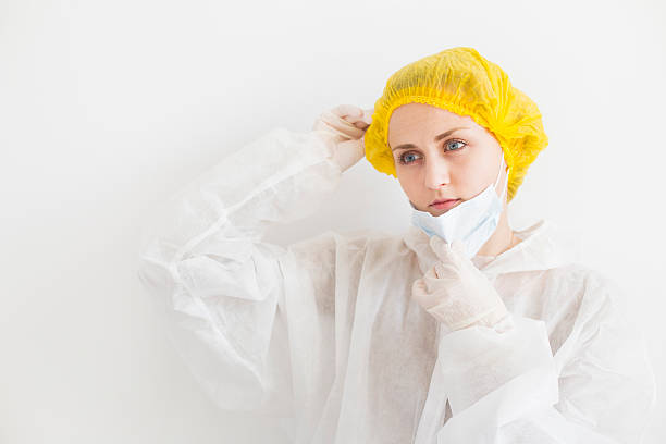istock Blonde woman holding her mask 541563608