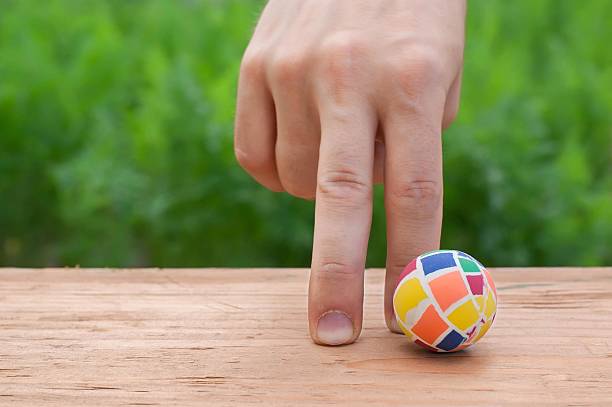 istock Human finger and soccer 541564086