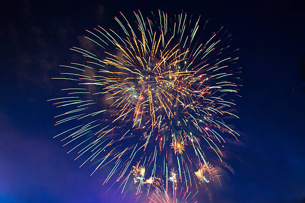 istock Fireworks in the evening sky with majestic clouds, long exposure 541564654