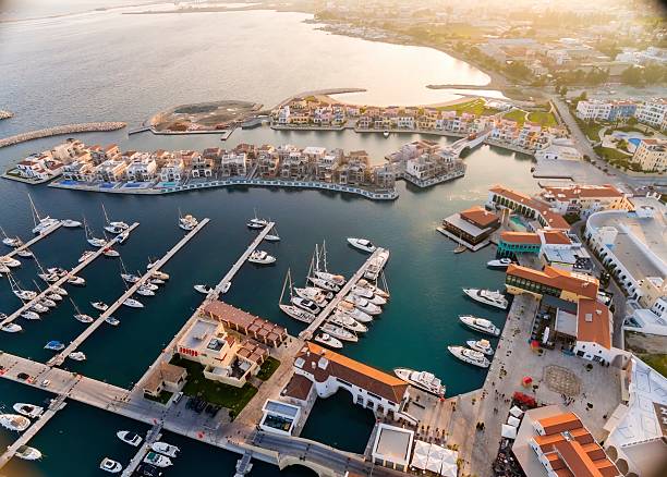 Aerial view of Limassol Marina, Cyprus Aerial view of the beautiful Marina in Limassol city in Cyprus, the beach, boats, piers, villas and commercial area. A very modern, high end and newly developed space where yachts are moored and it's perfect for a waterfront promenade. limassol marina stock pictures, royalty-free photos & images