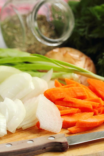 istock Sliced onion and carrot on chopping board 541564820
