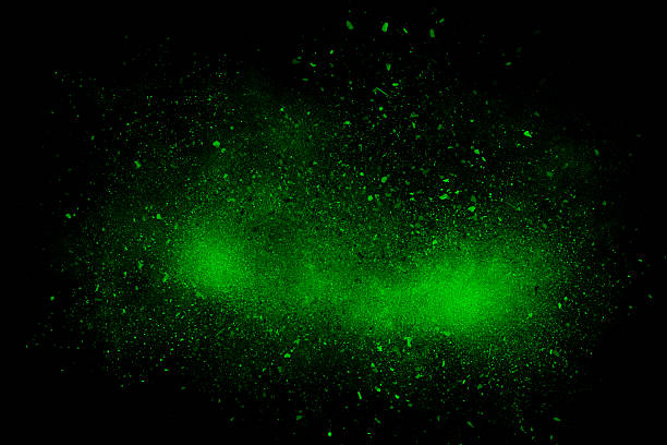 Green abstract powder explosion on a black background stock photo