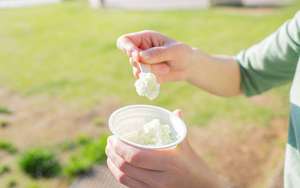 istock Asian woman eating ice cream 541567174