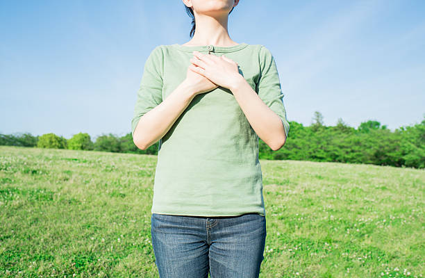 istock Asian woman holding her heart 541567892