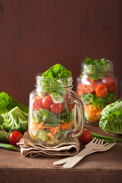 istock healthy vegetable salad in mason jar. tomato, broccoli, carrot, 541568224