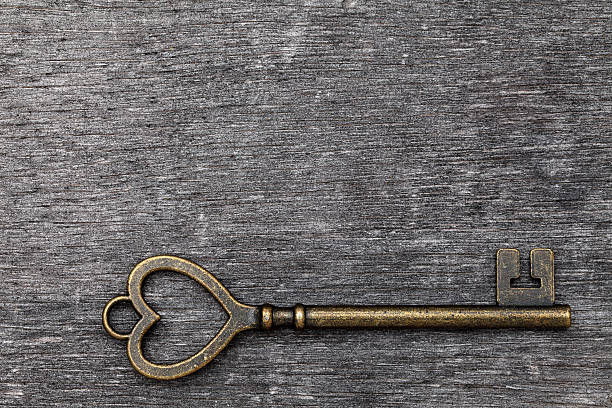 istock Heart shaped golden vintage key 541568926