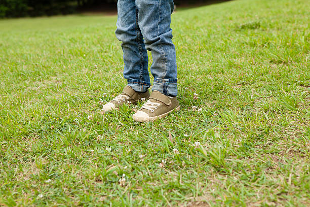 istock Boy standing in the park 541568958