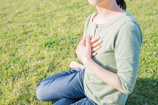 istock Asian woman holding her heart 541568966