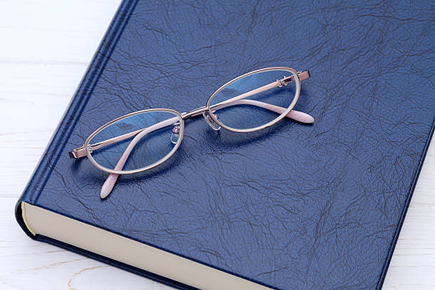 istock Ladies glasses and book 541569134
