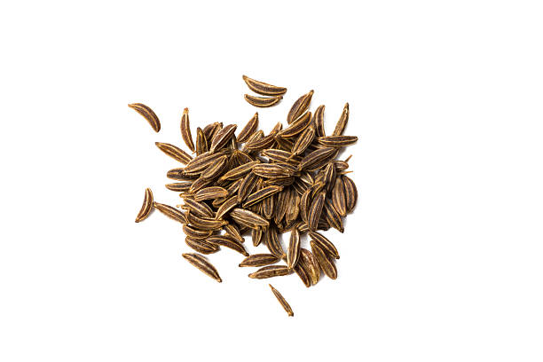 caraway seed isolated on white, view from above. - frenk kimyonu tohumu stok fotoğraflar ve resimler