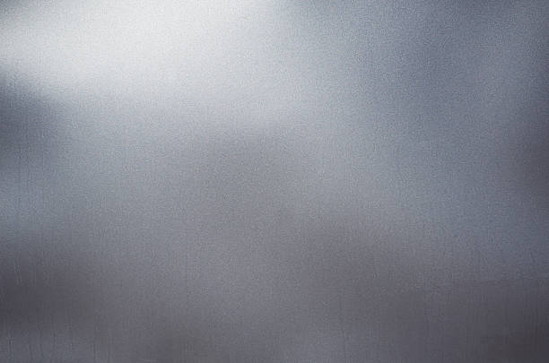 Shiny silver black gray sheet grunge old wall texture background Shiny empty silver black gray sheet grunge old wall texture background, stains on the dusty surface drab stock pictures, royalty-free photos & images