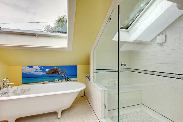 istock Bright bathroom interior upstairs with shower and bathtub. 541571366