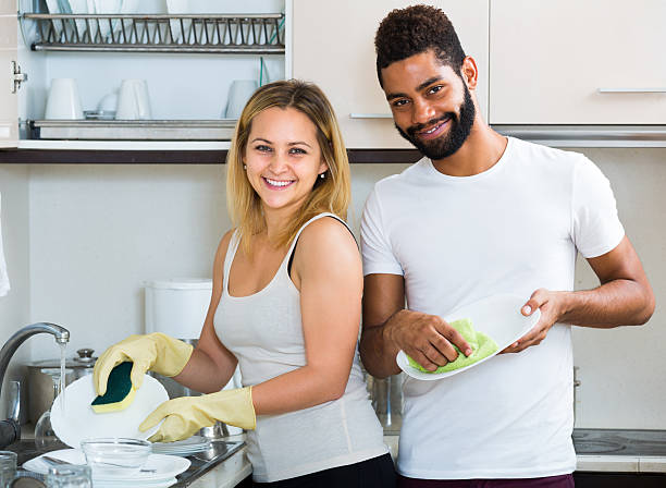 istock husband helping girl doing clean up 541571606