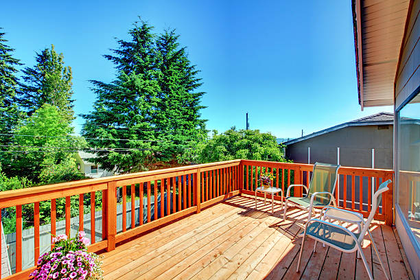 istock Nice open wooden deck with railings and beautiful scenery. 541572642