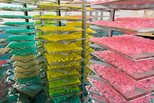 Trays of colorful wagashi sweets stacked and left to set in Kyoto, Japan