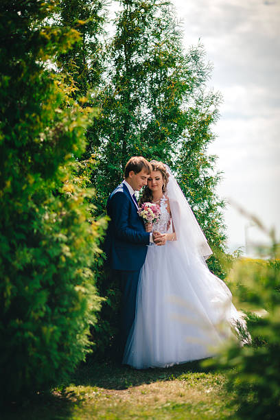 istock beautiful young couple posing  on a background of windows 541573616