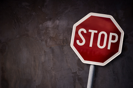 Sign STOP isolated on grunge background