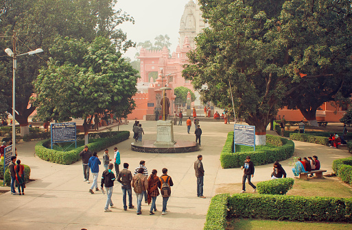 Varanasi, India - January 3, 2013: Students go to campus through the park of Bannares Hindu University on January 3, 2013. The University is one of largest residential universities in Asia with 20,000 students