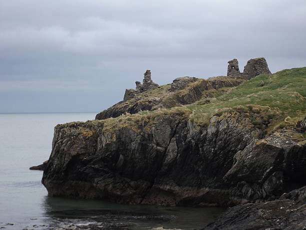 istock coast with demolished castle and cloudy sky 541581488