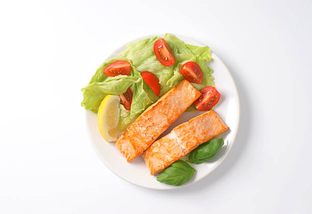 istock salmon fillets with vegetable garnish 541581754