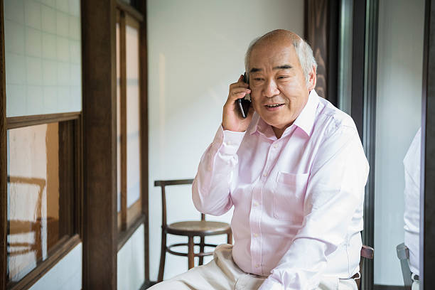 istock Senior Japanese man on telephone 541582202