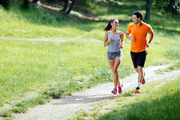 istock Beautiful couple jogging in nature 541585084