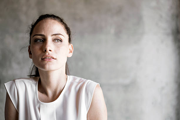 istock Thoughtful woman against wall 541585388