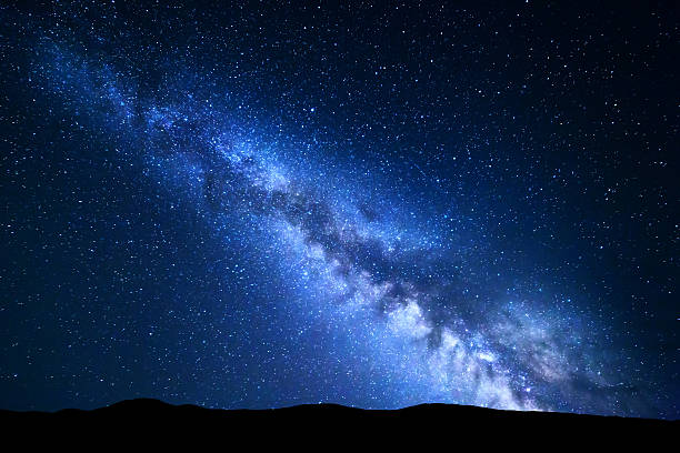 istock Night landscape with Milky Way. Starry sky, Universe 541587920