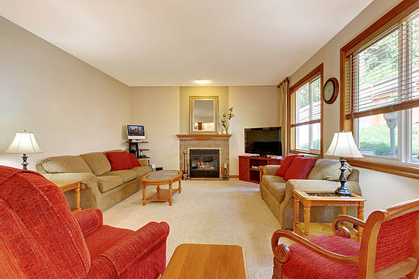 istock House interior. Peach and red living room with fireplace 541588778