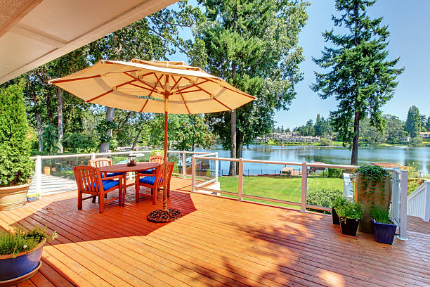 istock Sitting room area on screened walkout deck with patio table 541589584