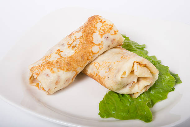 istock Stuffed pancakes on white plate 541589602