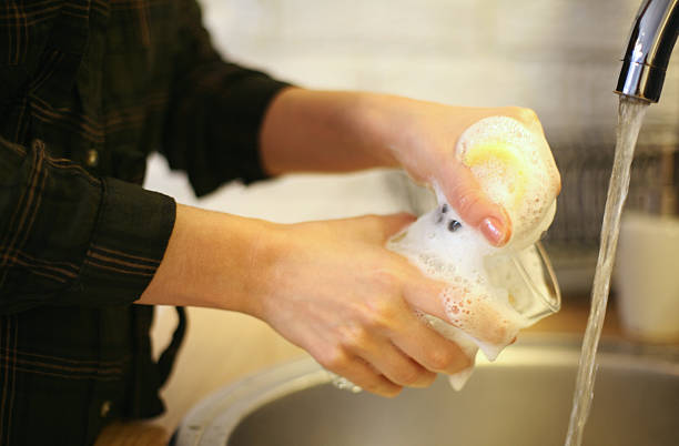 istock Woman washing dishes. 541589700