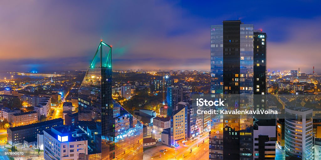 Aerial panorama city at night, Tallinn, Estonia Aerial panorama of modern business financial district with tall skyscraper buildings illuminated at night, Tallinn, Estonia Estonia Stock Photo