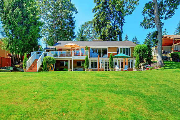 istock House exterior with impressive backyard landscape design and patio area. 541590210