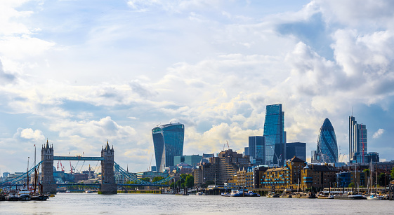 Stunning London cityscape with Tower Bridge against a sky with dramatic clouds