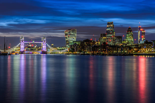 Illuminated London Cityscape During Sunset Panoramic view of illuminated London cityscape at sunset london gherkin at night stock pictures, royalty-free photos & images