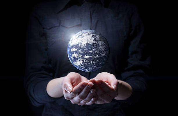 Hand of businessman holding earth planet Hand of businessman holding earth planet. Elements of this image are furnished by NASA finger spinning globe stock pictures, royalty-free photos & images
