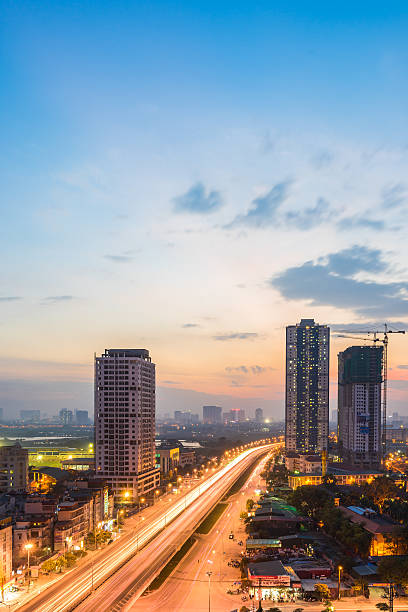 istock Amazing sunset on highway - Hanoi Cityscape 541592472