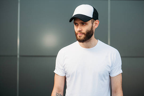 istock Hipster wearing white blank t-shirt and a baseball cap 541593032