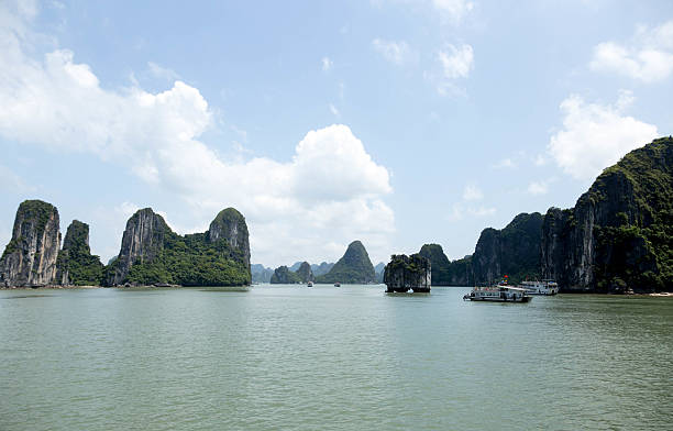 sea landscape with tourist boat in halong bay vietnam - long bay imagens e fotografias de stock
