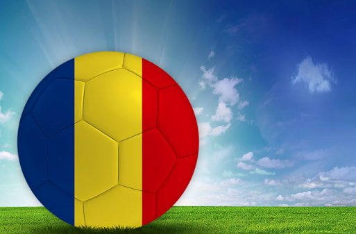 Soccer ball in nature with Romanian flag